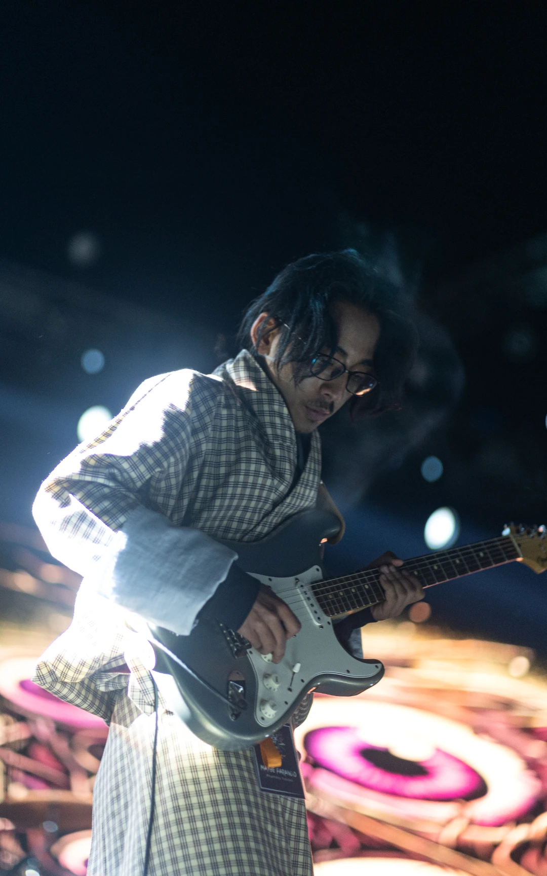 Solo photograph of Maybe Parnoid's Guitarist performiing live at Asia Rock Fest Bhutan 2025