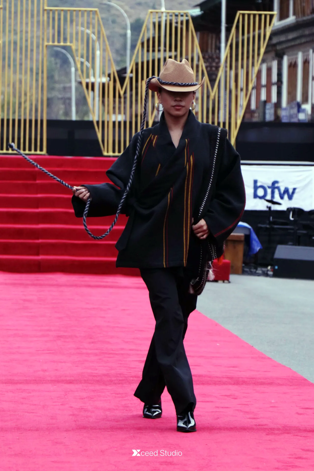 Iconic highland inspired designed model runway photography during the main event at Paro Streets, Bhutan.